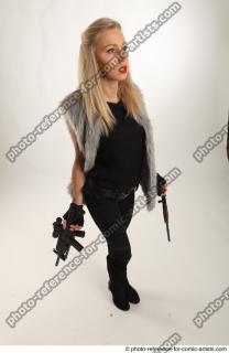 NIKOL STANDING POSE WITH GUNS